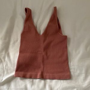 Pinkish red ribbed tank top.